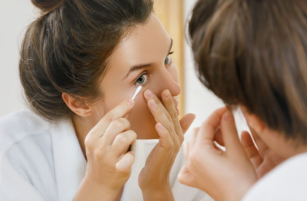 A person maintaining their eyelid hygiene at home after getting a BlephEx treatment.