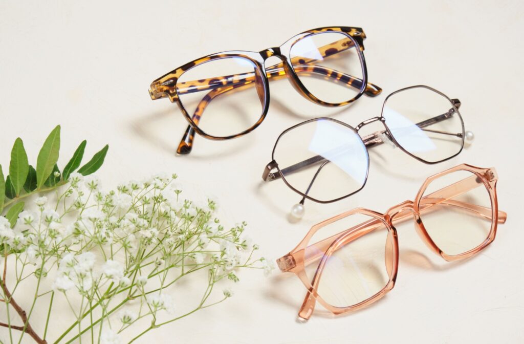 Three glasses with different shaped frames and colours on elegant display.